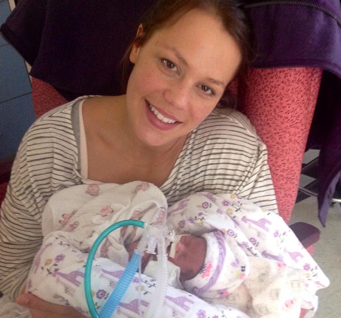 Jessica holding her daughter for the first time. - jessica-holding-logan-in-nicu